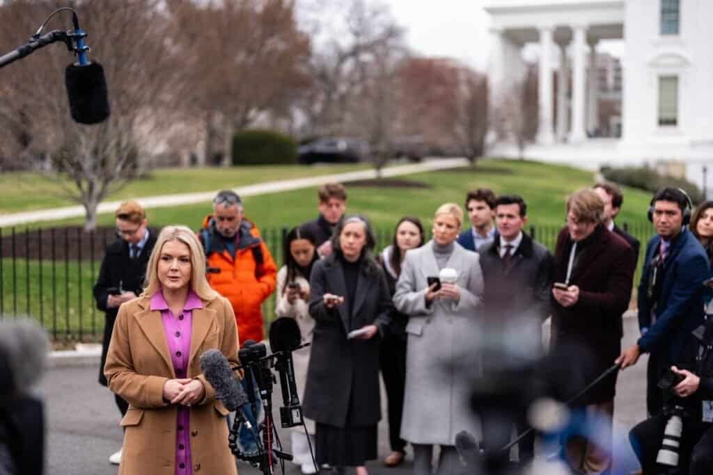 Journalists work in the White House press area in Washington during coverage of the Trump administration.