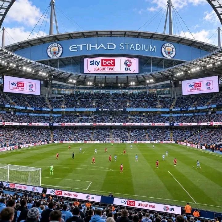 Manchester City players competing during a Premier League match.