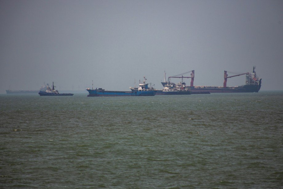 Commercial vessels transiting the Strait of Hormuz, a key global energy shipping route.