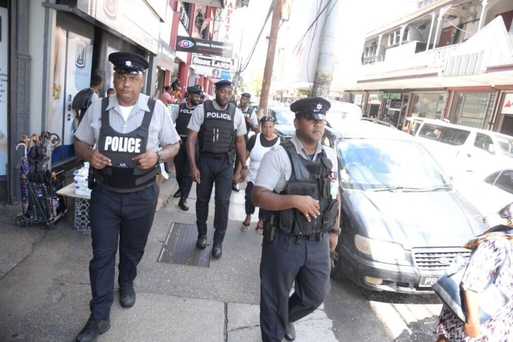 Trinidad and Tobago police officers conducting a security patrol.