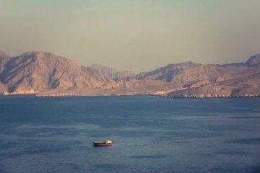 Commercial vessels and oil tankers near the Strait of Hormuz.