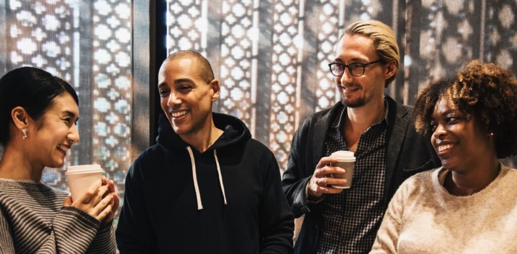  A small group of people talking together in a casual social setting.