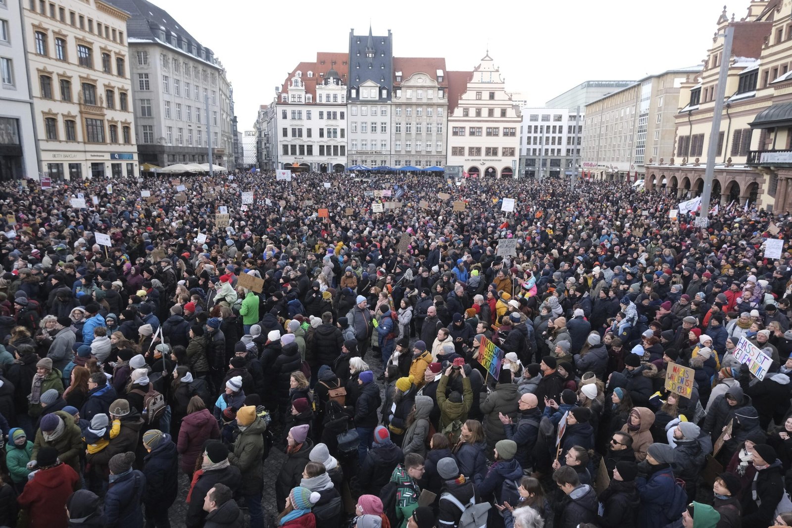 Crowd of demonstrators filling a German city street during a large public protest