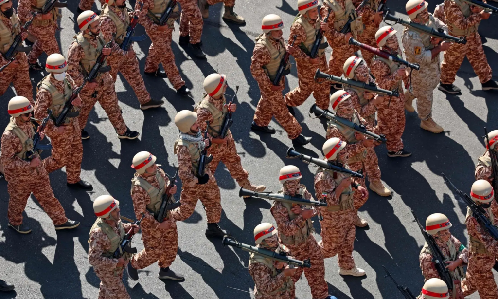 Iranian military personnel march during a public military event in Tehran.
