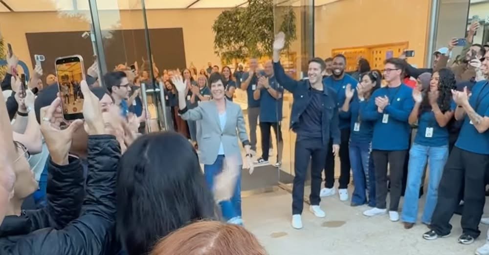 A crowd of customers lined up outside an Apple store on launch day.