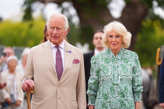 King Charles III and Queen Camilla standing together at an official event.