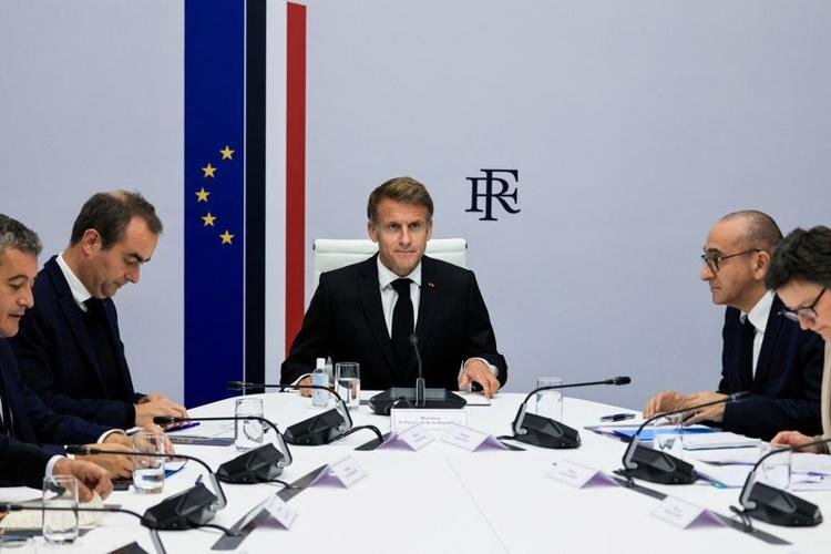 French government officials attend a security meeting following violent protests.