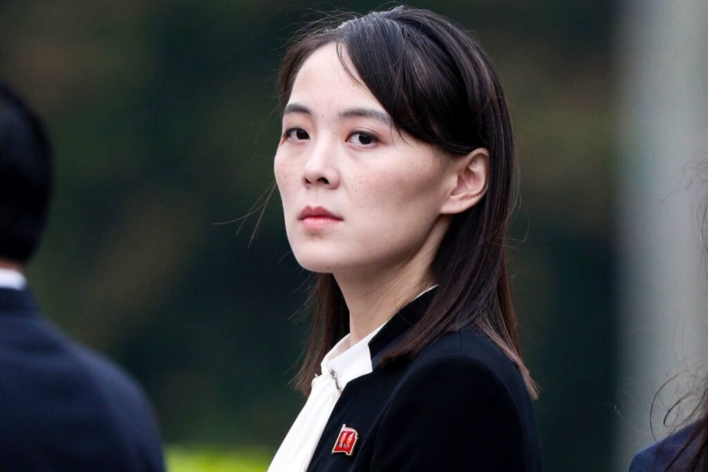 Kim Yo Jong in dark clothing walking at an official event.