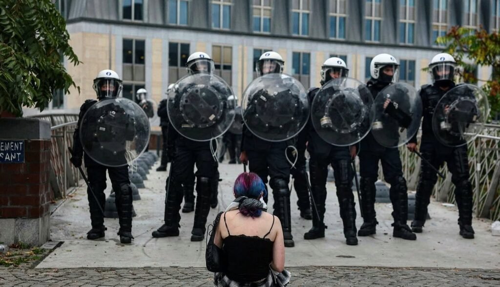Police officers standing outside a university building in Liège.
