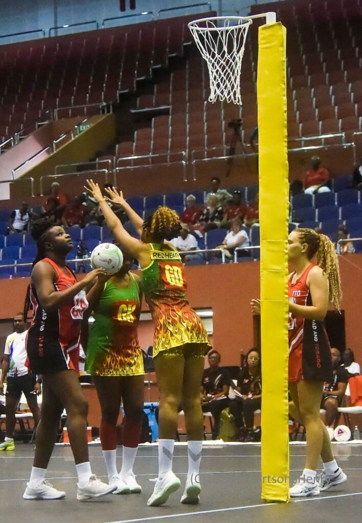 Trinidad and Tobago and Grenada players contest possession during a netball World Cup qualifying match in Barbados.