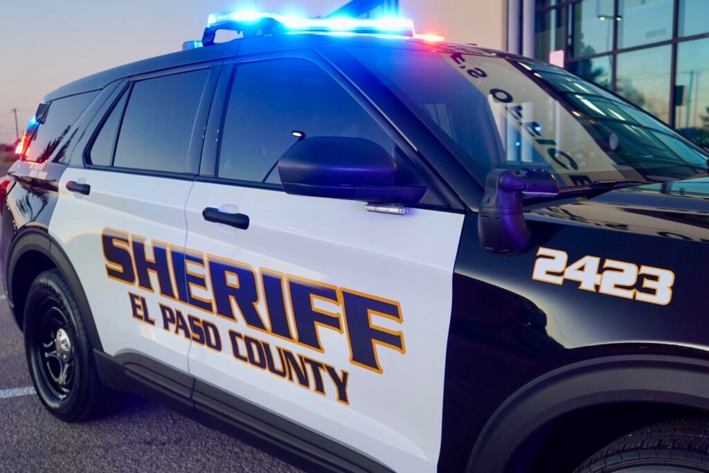 A marked sheriff’s patrol SUV parked on a street.