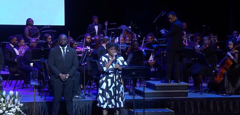 Musicians on a stage in front of an audience.