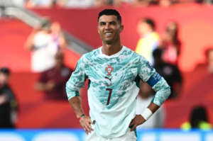 Cristiano Ronaldo in Portugal’s national team kit during an international football match.