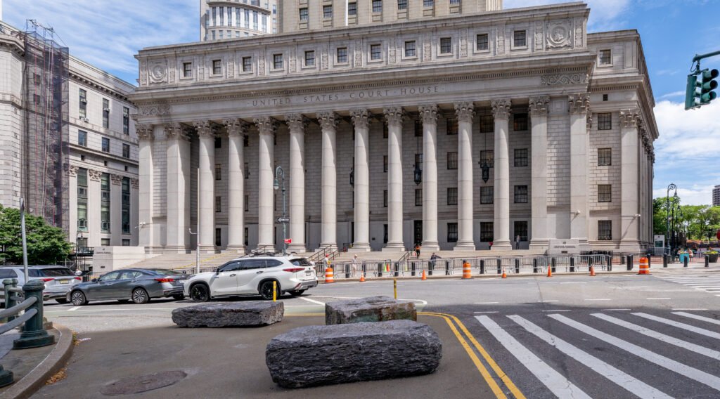 Stone facade and columns of a federal courthouse in lower Manhattan.