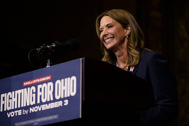 Amy Acton speaking to supporters at a campaign event.