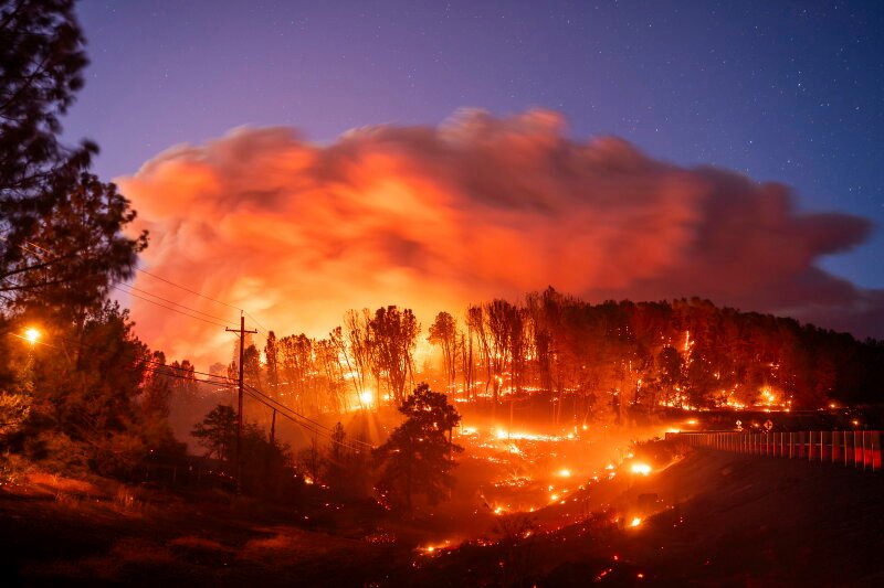 Damaged structures and debris are seen following a natural disaster.