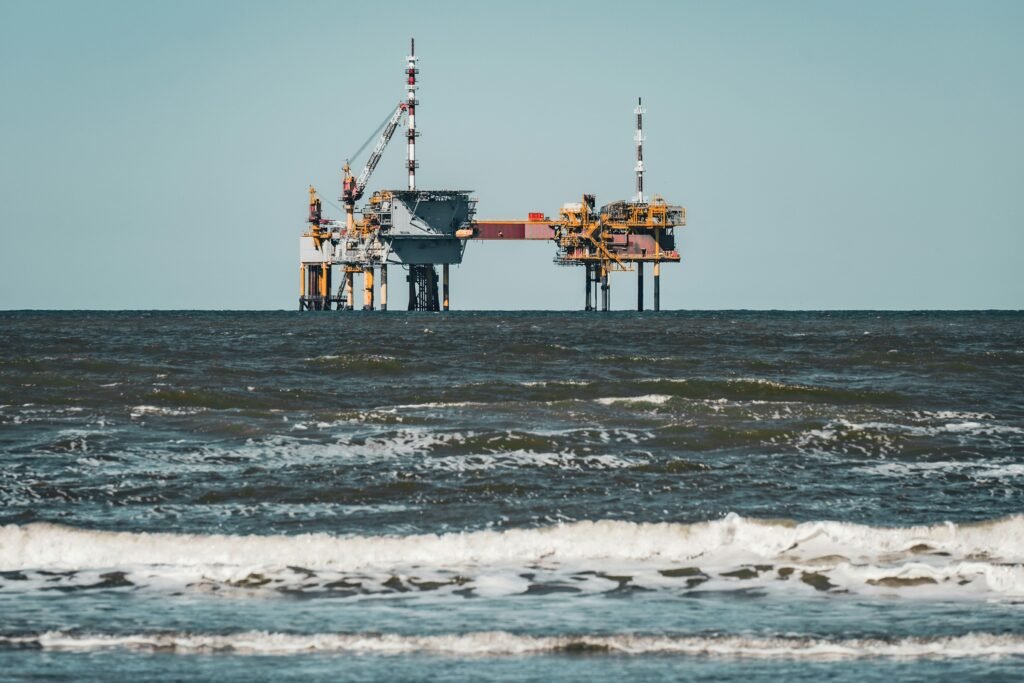 A large oil tanker ship travels across open water.